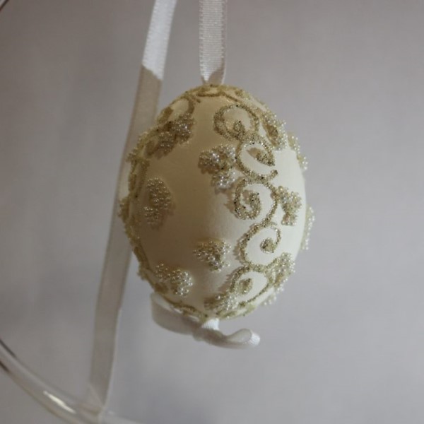 Egg decorated with white pearls