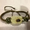 3C1050A - Armband met zwarte/lichtbruine kever - Masterpieces.nl