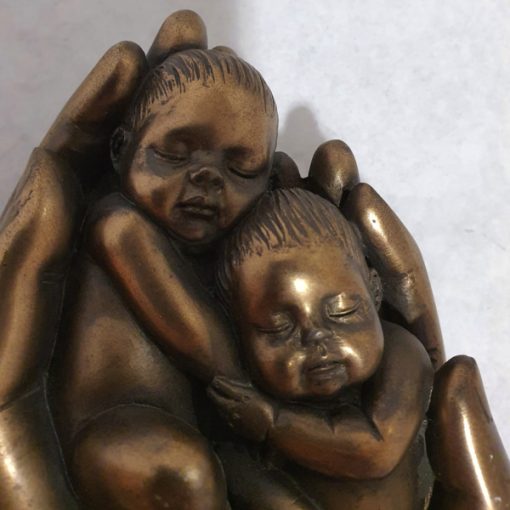 BC283 - Two babies carried in two hands - Masterpieces.nl