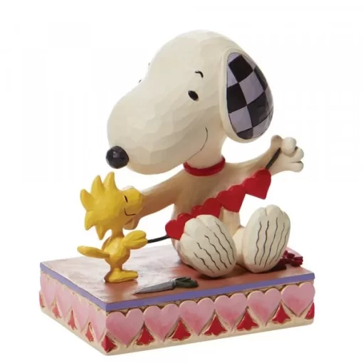 6007937 - Stringing Hearts (Snoopy with Hearts Garland Figurine) - Masterpieces.nl